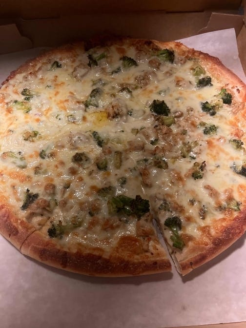 Sun's Alfredo Supreme Pizza.